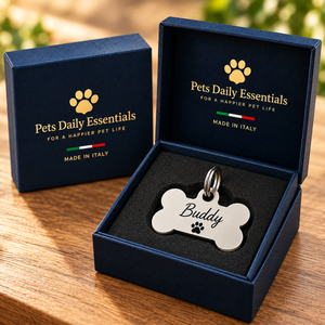 Illustrative Bone Stainless Steel pet ID tag inside navy-and-gold Pets Daily Essentials box with Italian flag