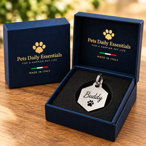 Illustrative Hexagon Stainless Steel pet ID tag inside navy-and-gold Pets Daily Essentials box with Italian flag